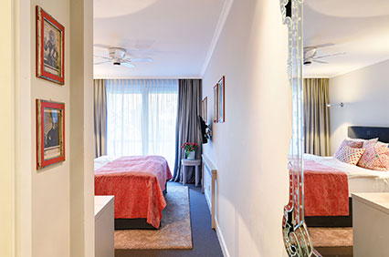 Double room facing the inner courtyard - with garden view - of the Hotel Admiral, Munich